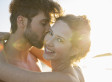 Portrait of smiling young couple in sunlight